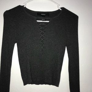 A dark gray long sleeve shirt